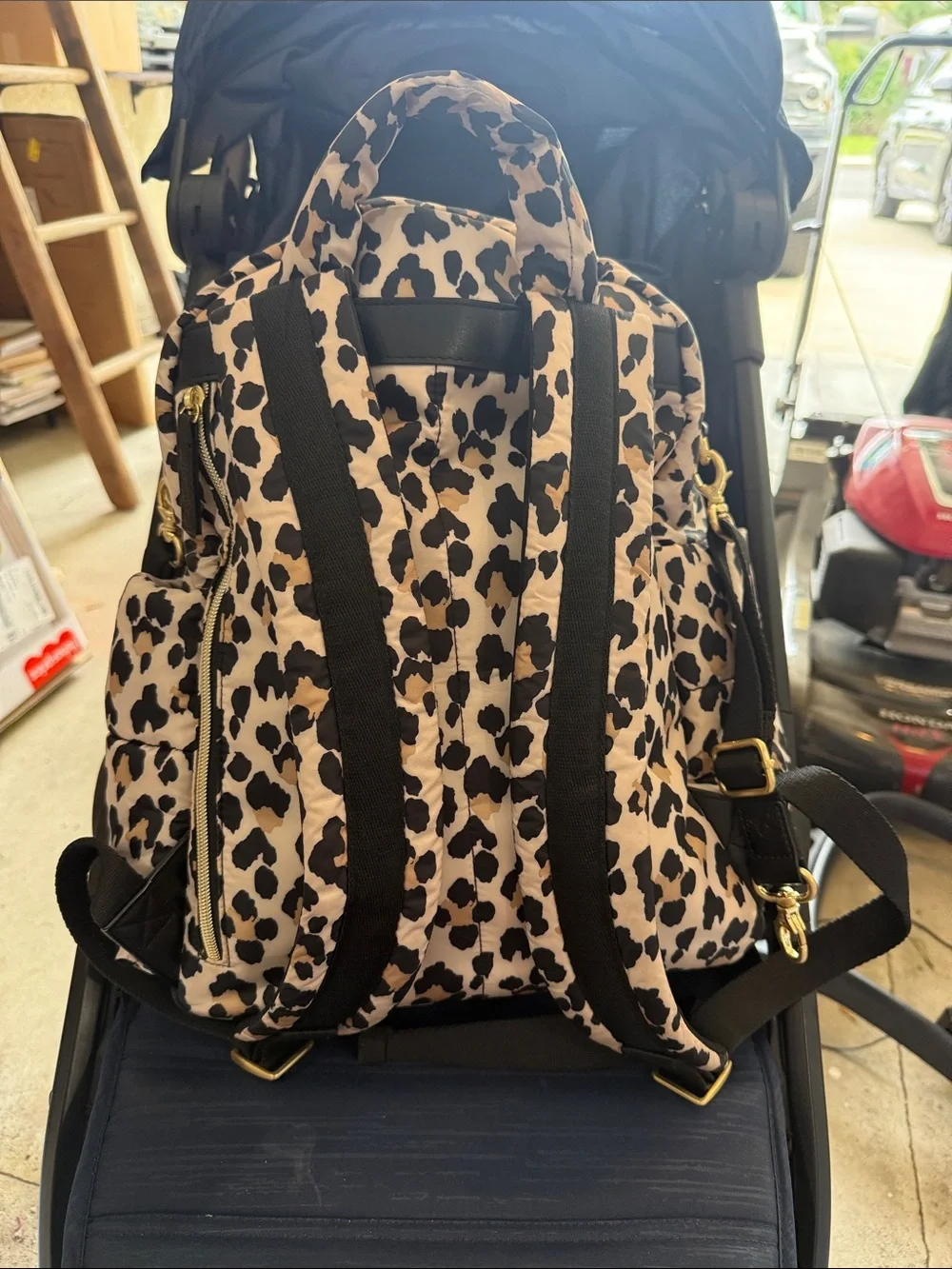 Itzy Ritzy Leopard Print Backpack in Beige and Black